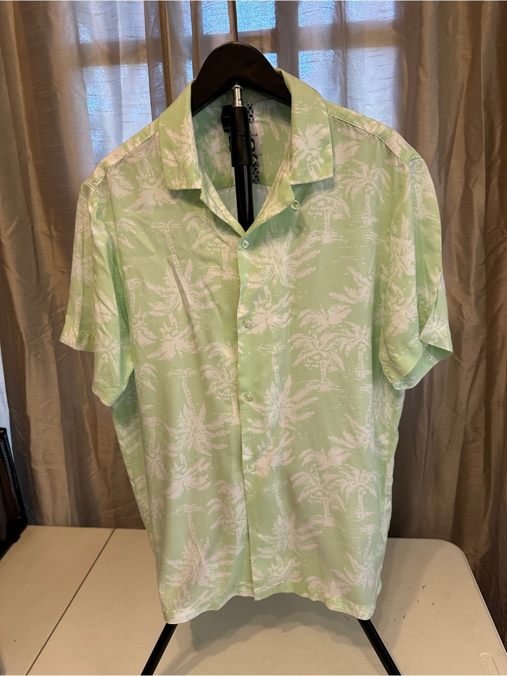 Denim & Flower Pale Green Button-Down Shirt with white tropical design.